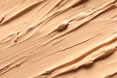 Photo of Texture of skin foundation as background, closeup