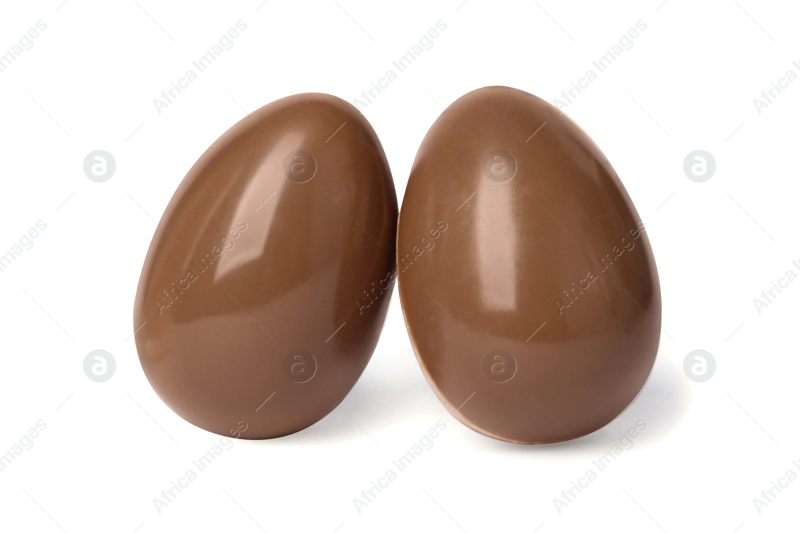 Photo of Two tasty chocolate eggs isolated on white
