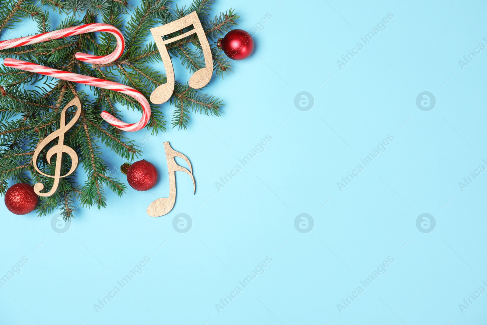Photo of Composition with wooden music notes and space for text on color background, top view
