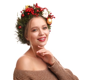 Photo of Beautiful young woman wearing Christmas wreath on white background