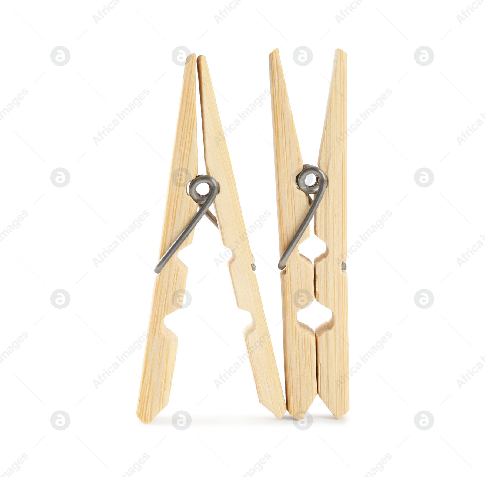 Photo of Two classic wooden clothespins on white background