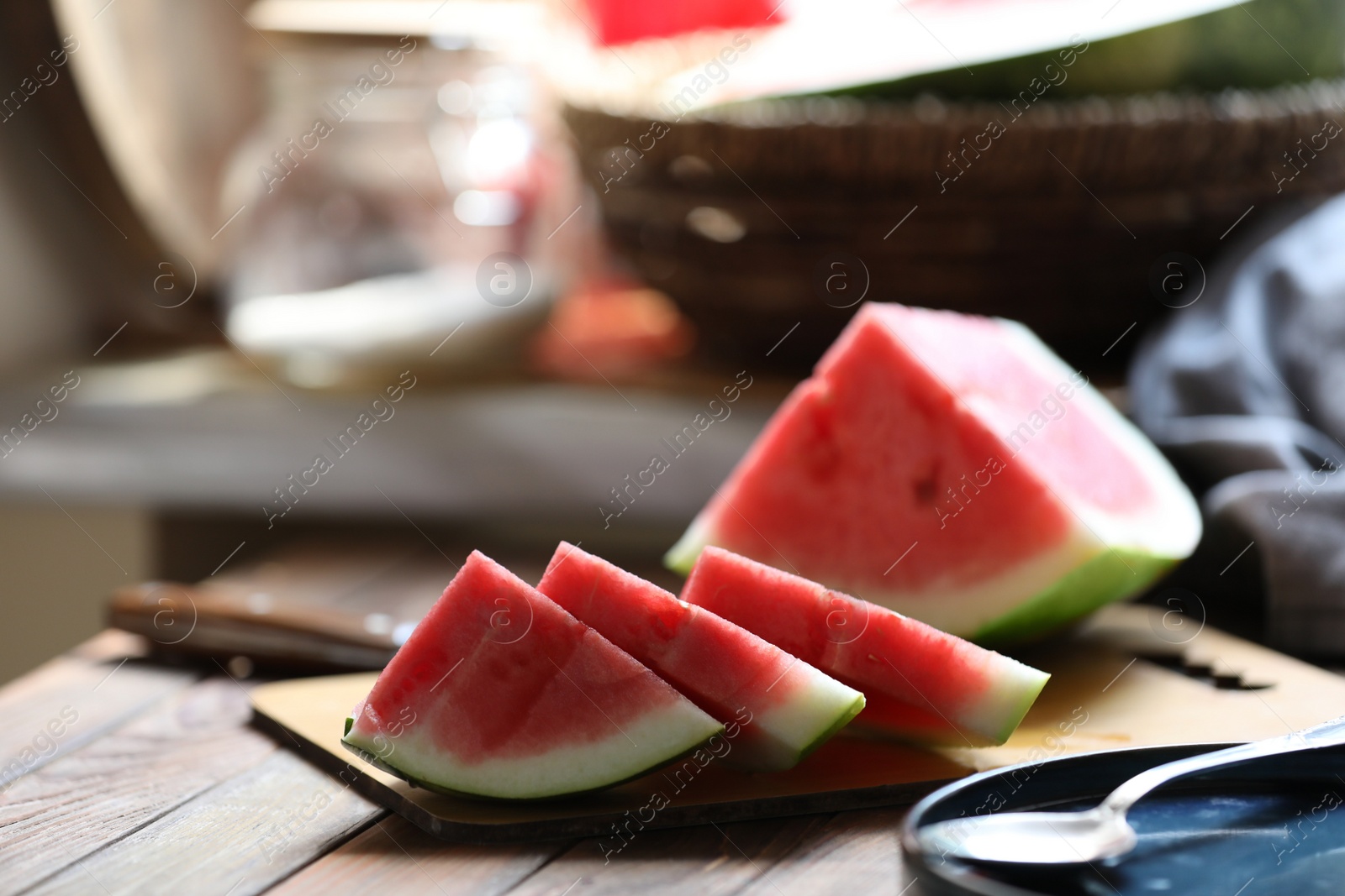 Photo of Sliced fresh juicy watermelon on wooden table. Space for text