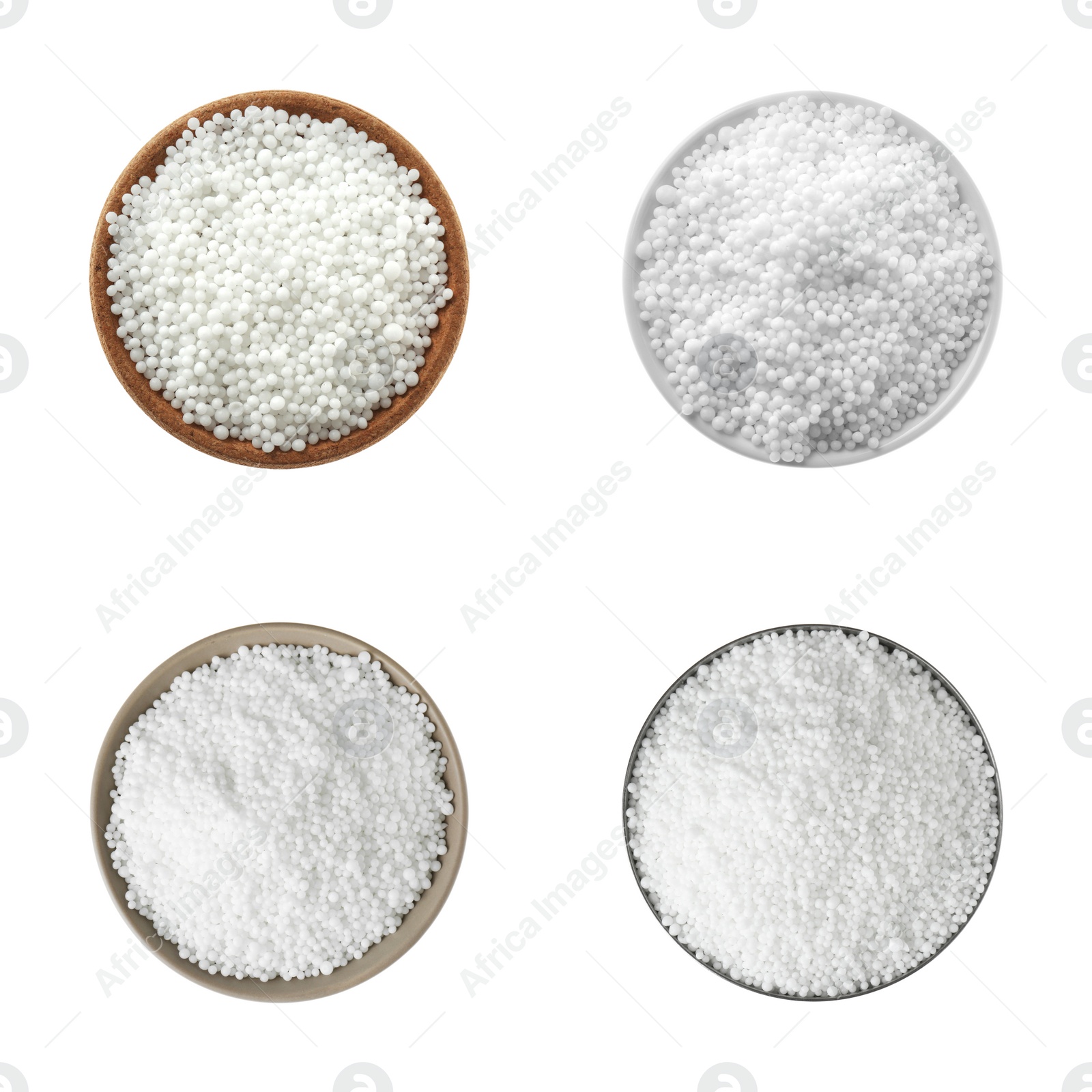 Image of Set with ammonium nitrate pellets in bowls on white background, top view. Mineral fertilizer