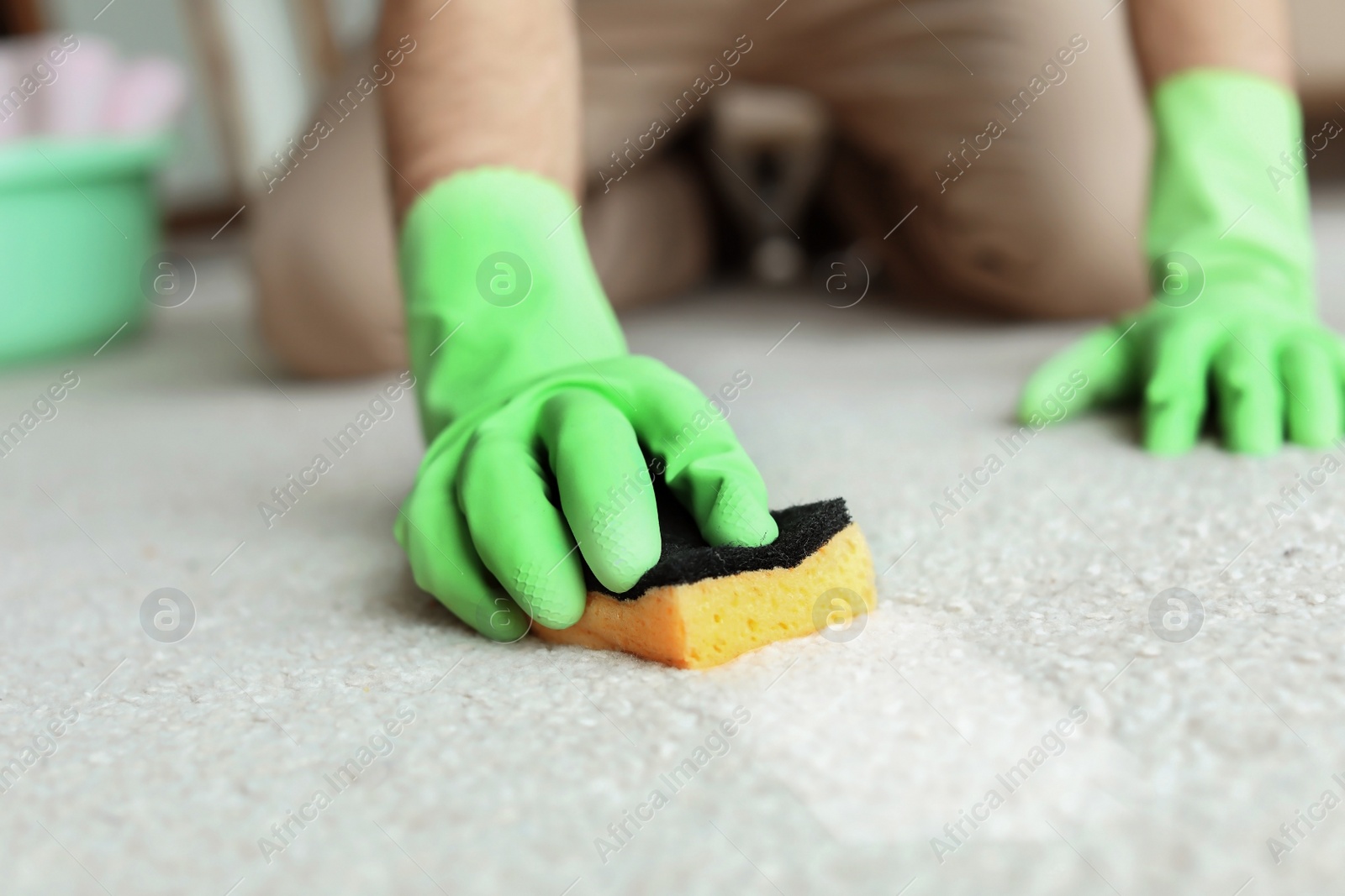 Image of Man removing dirt from carpet at home, closeup. Cleaning service