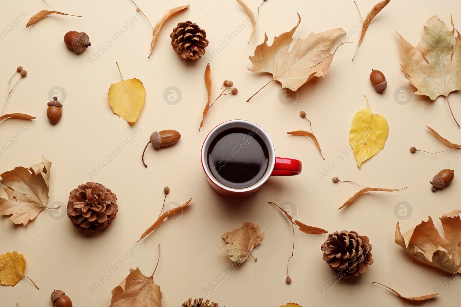 Photo of Flat lay composition with hot drink on beige background. Cozy autumn