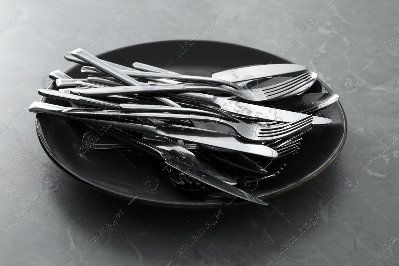 Photo of Different clean kitchenware on light grey marble table