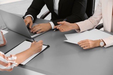 Human resources commission conducting job interview with applicant in office, closeup