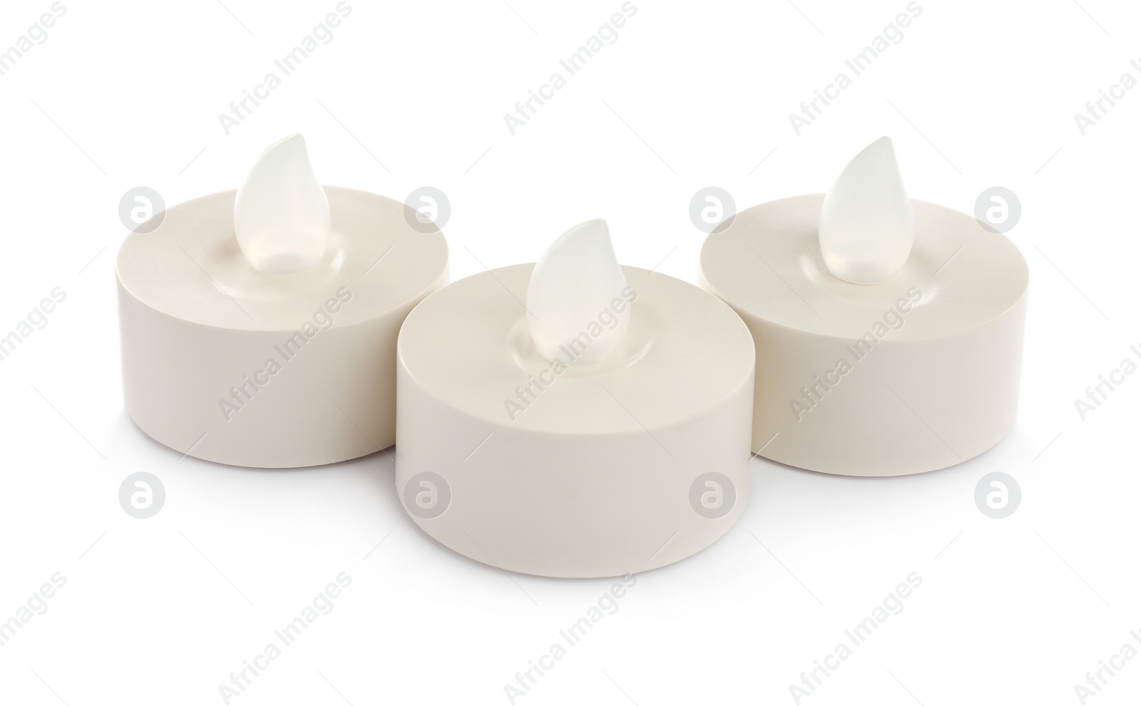 Photo of Decorative flameless LED candles on white background