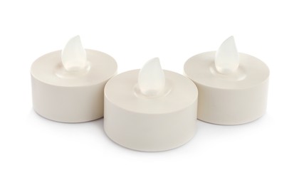 Decorative flameless LED candles on white background