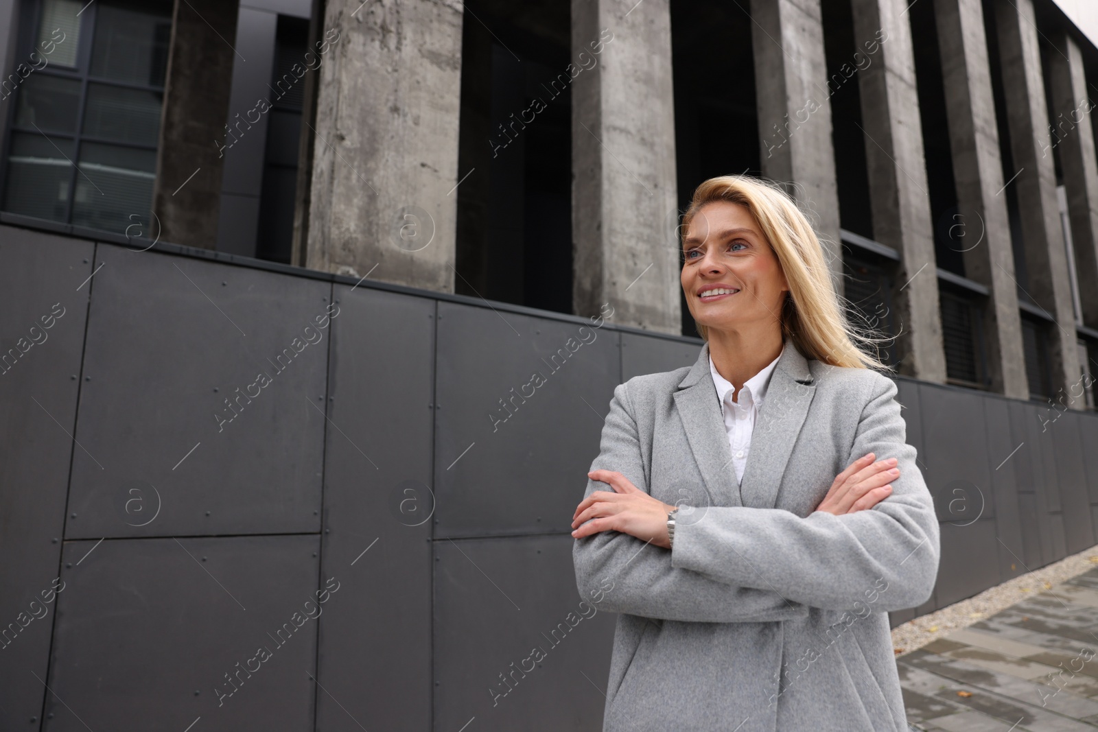 Photo of Portrait of smiling woman outdoors, space for text. Lawyer, businesswoman, accountant or manager