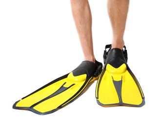 Man wearing yellow flippers on white background, closeup