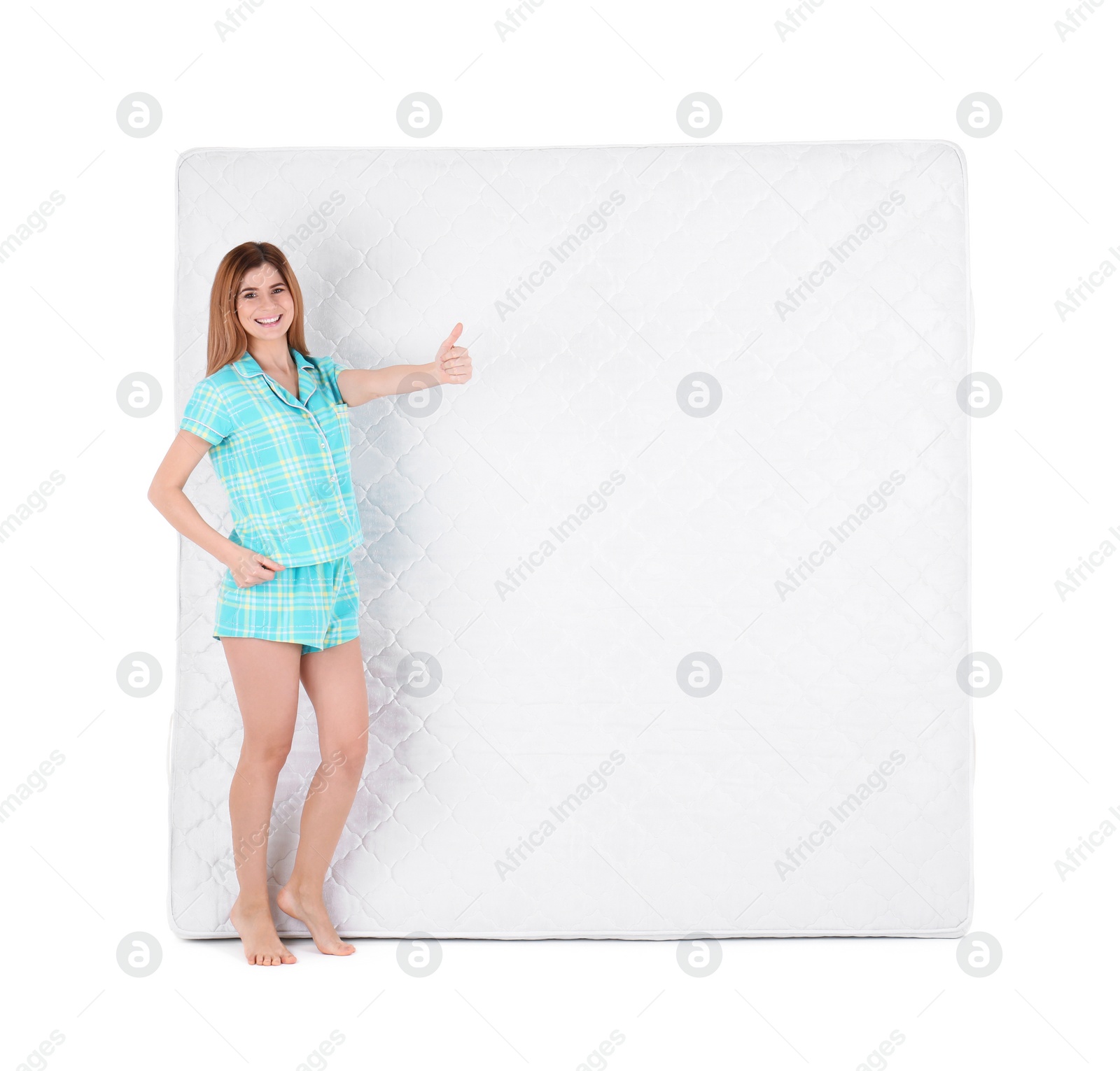 Photo of Woman with comfortable mattress isolated on white