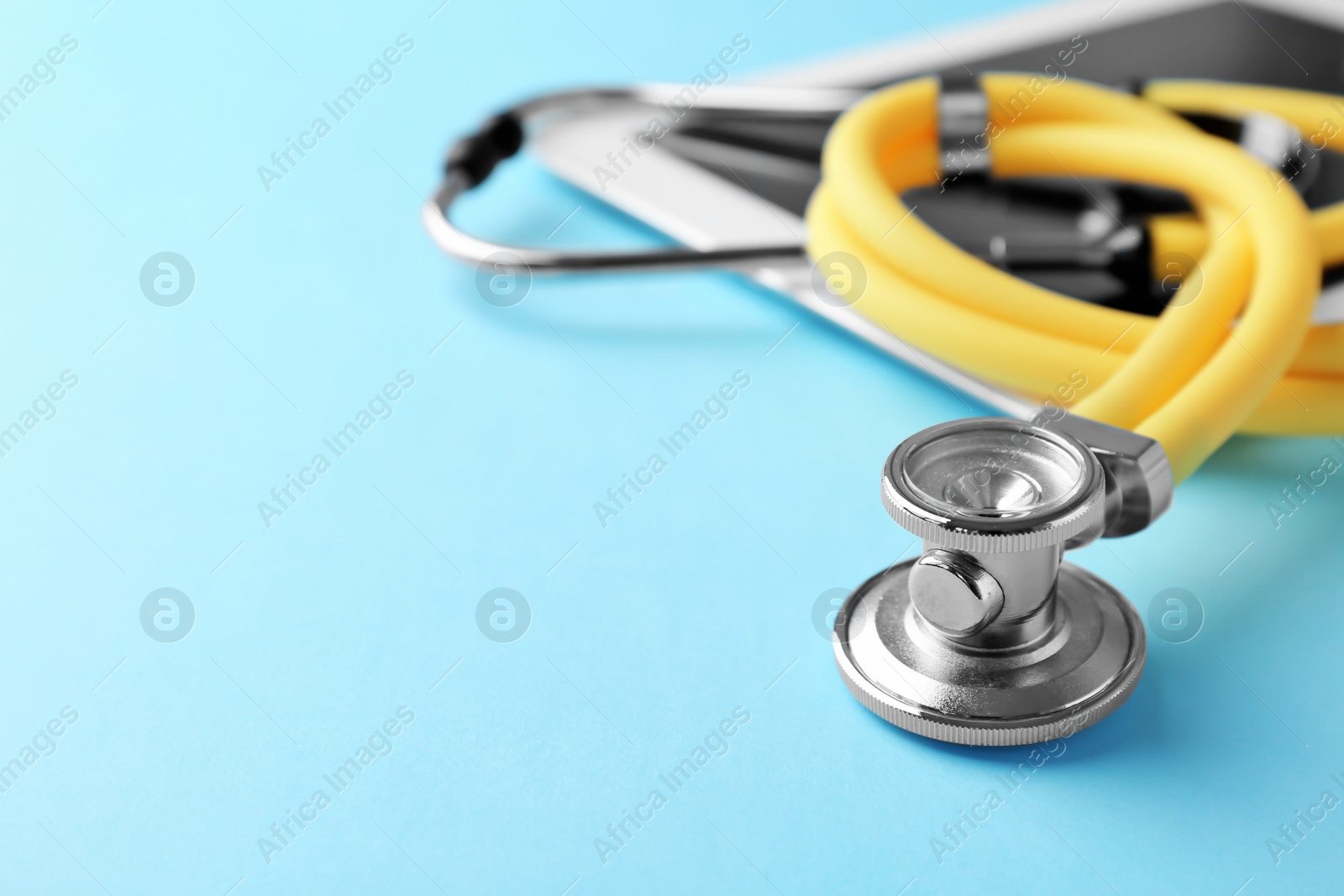 Photo of Stethoscope on color background, closeup. Medical equipment