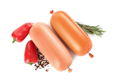 Photo of Tasty boiled sausages with vegetables, rosemary and spices on white background, top view