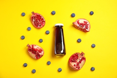 Flat lay composition with juice in bottle and ingredients on color background