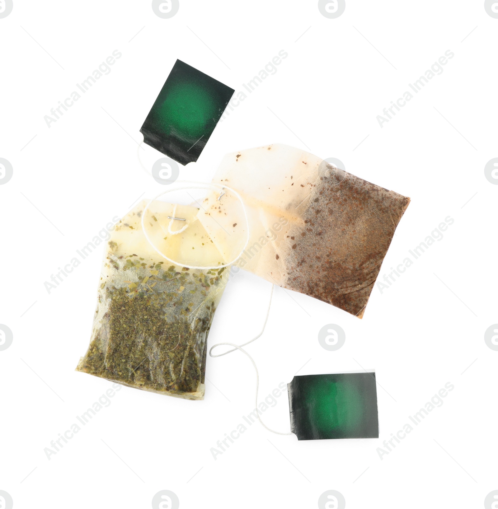 Photo of Used tea bags on white background, top view