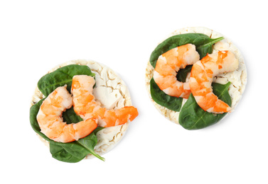 Photo of Puffed rice cakes with shrimps and basil isolated on white, top view