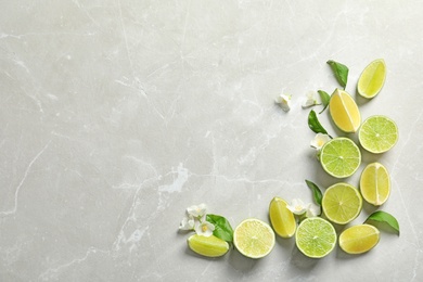 Composition with fresh ripe limes on light background, top view