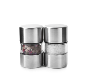 Photo of Pepper and salt in shakers isolated on white