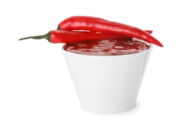 Photo of Bowl with red sauce and fresh chili peppers isolated on white