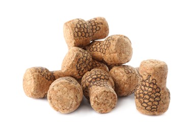 Heap of sparkling wine corks on white background