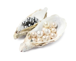Photo of Oyster shells with different pearls on white background
