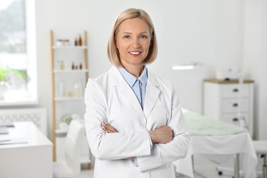 Photo of Portrait of happy dermatologist in modern clinic
