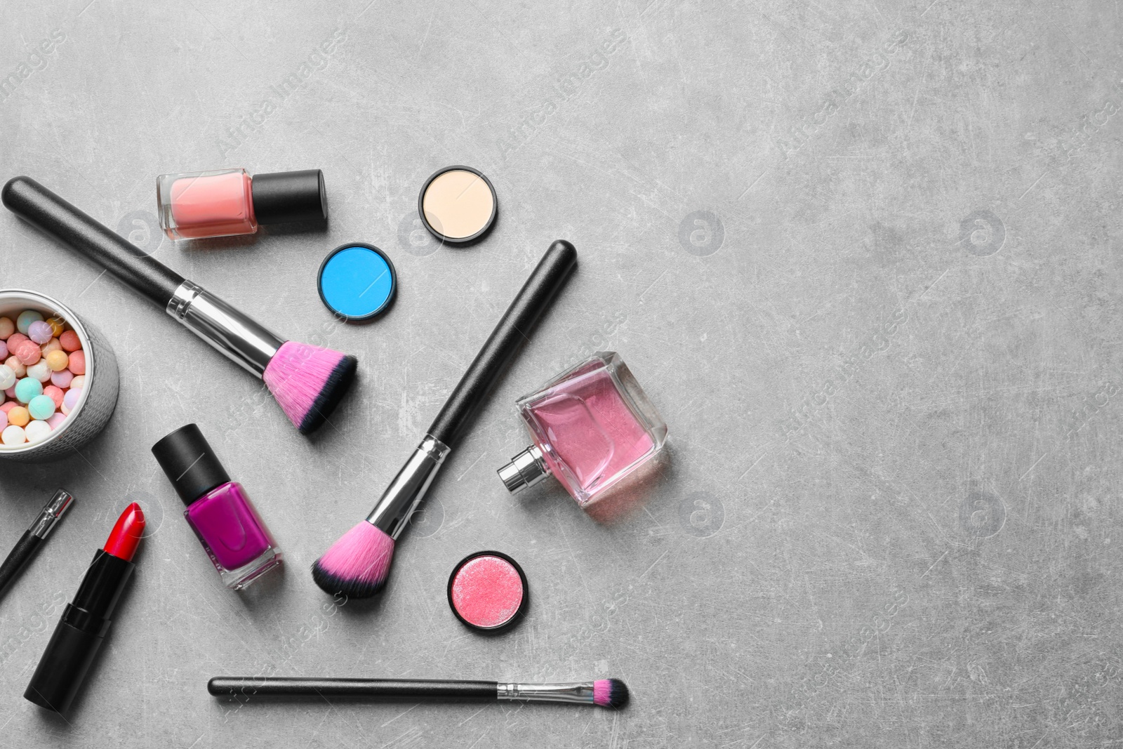 Photo of Flat lay composition with decorative cosmetics on gray background