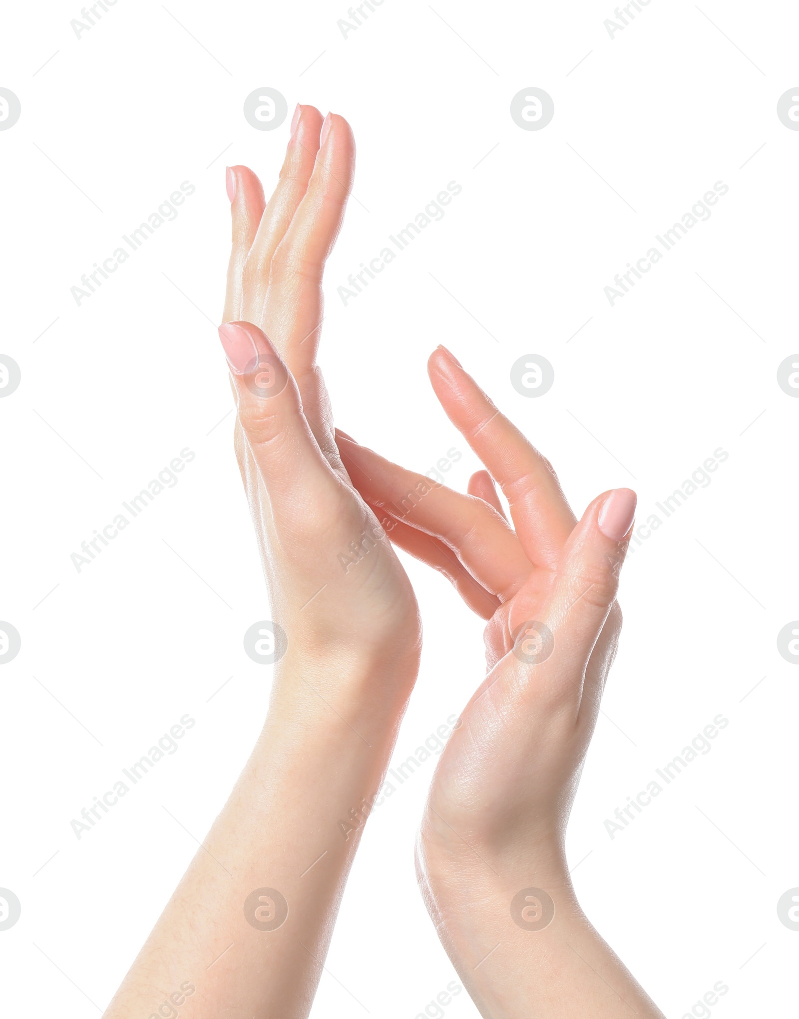 Photo of Woman applying cream on her hand against white background, closeup