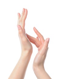 Photo of Woman applying cream on her hand against white background, closeup