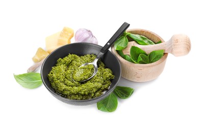 Photo of Fresh tasty pesto sauce and ingredients isolated on white