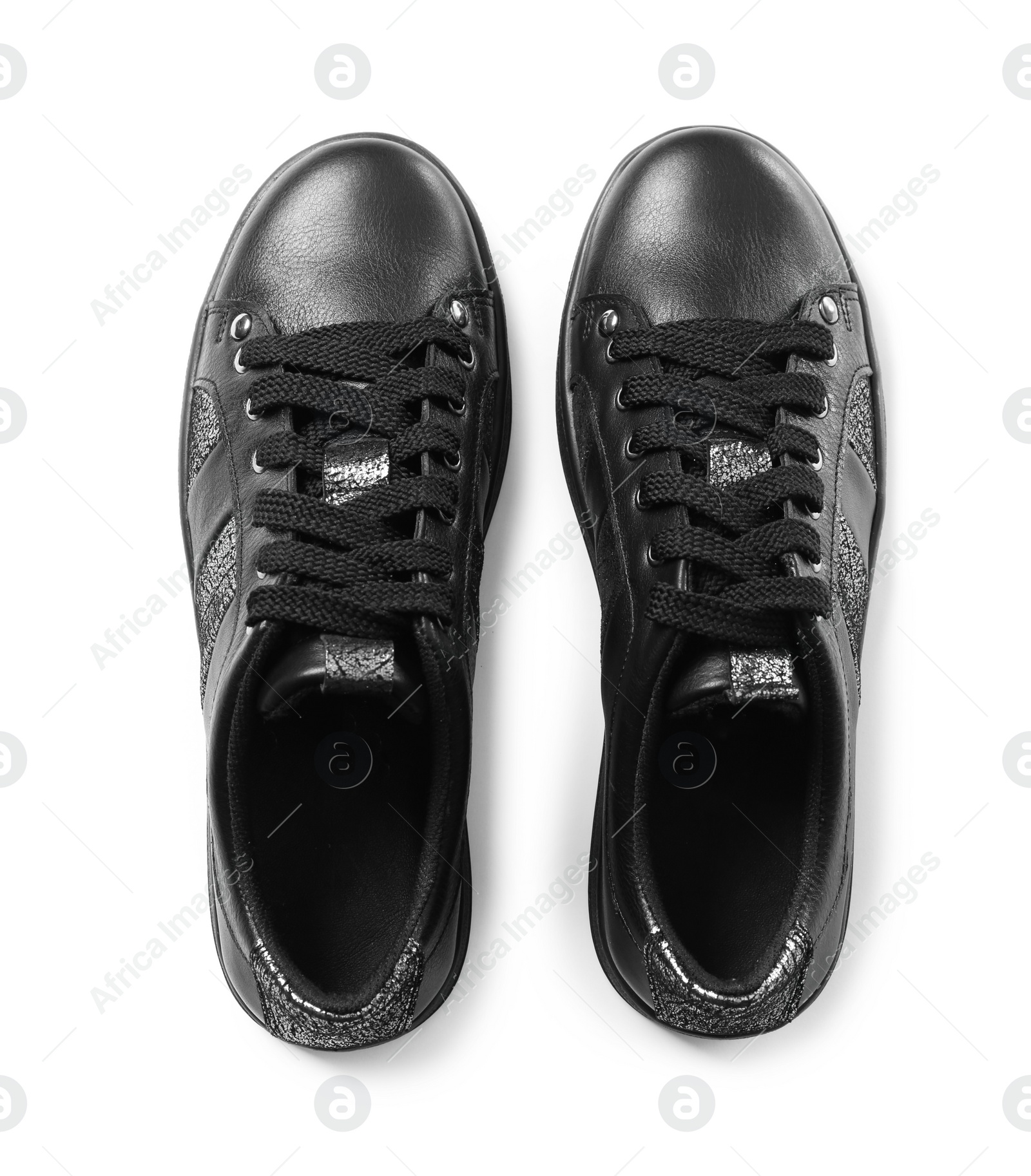 Photo of Stylish modern shoes on white background, top view