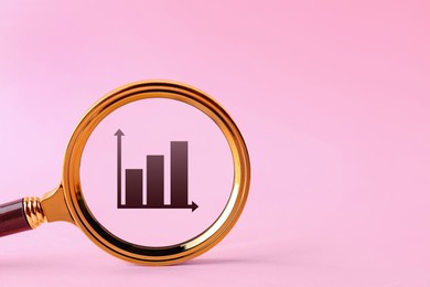 Graph on pink background, space for text. View through magnifying glass