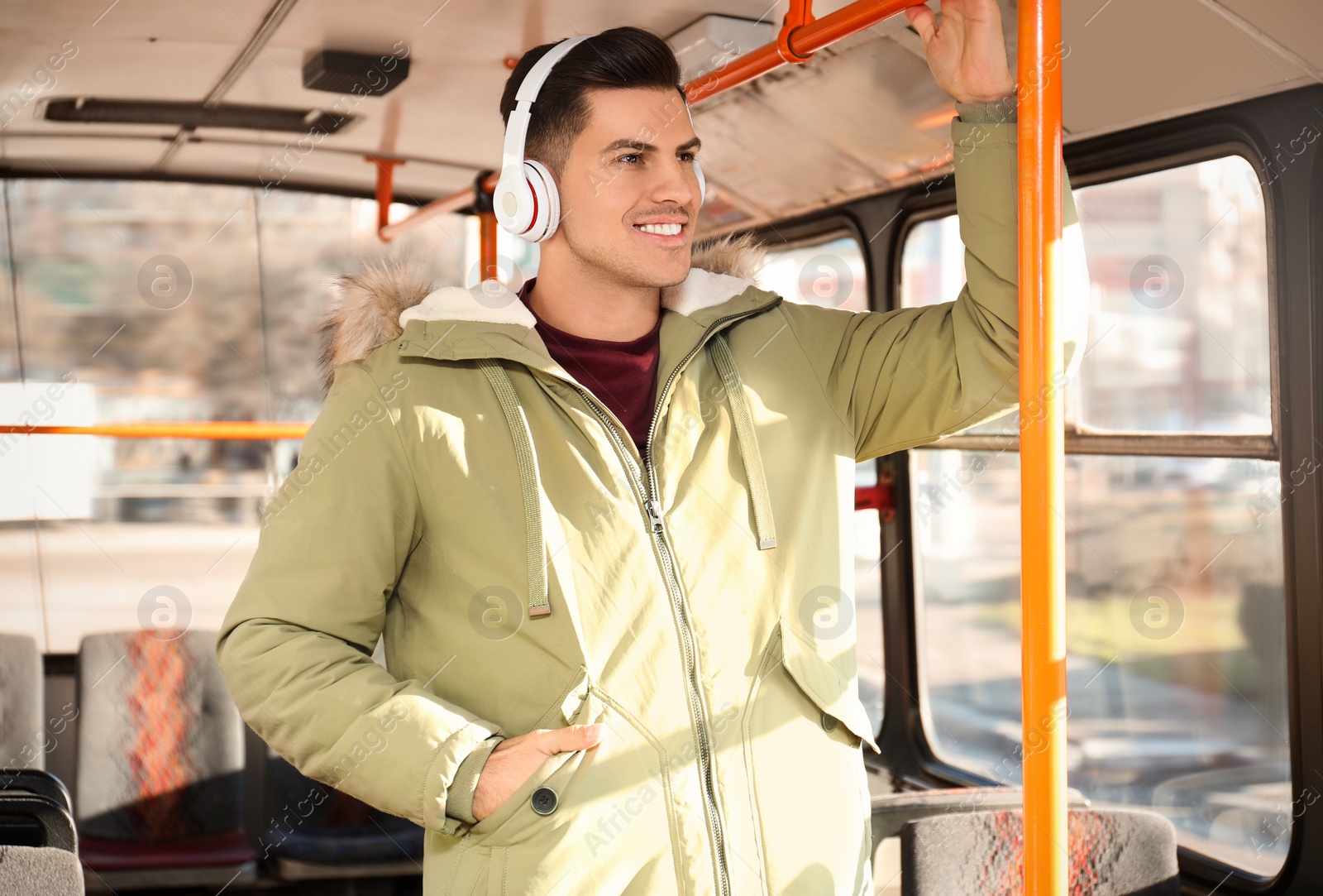 Photo of Man listening to audiobook in trolley bus