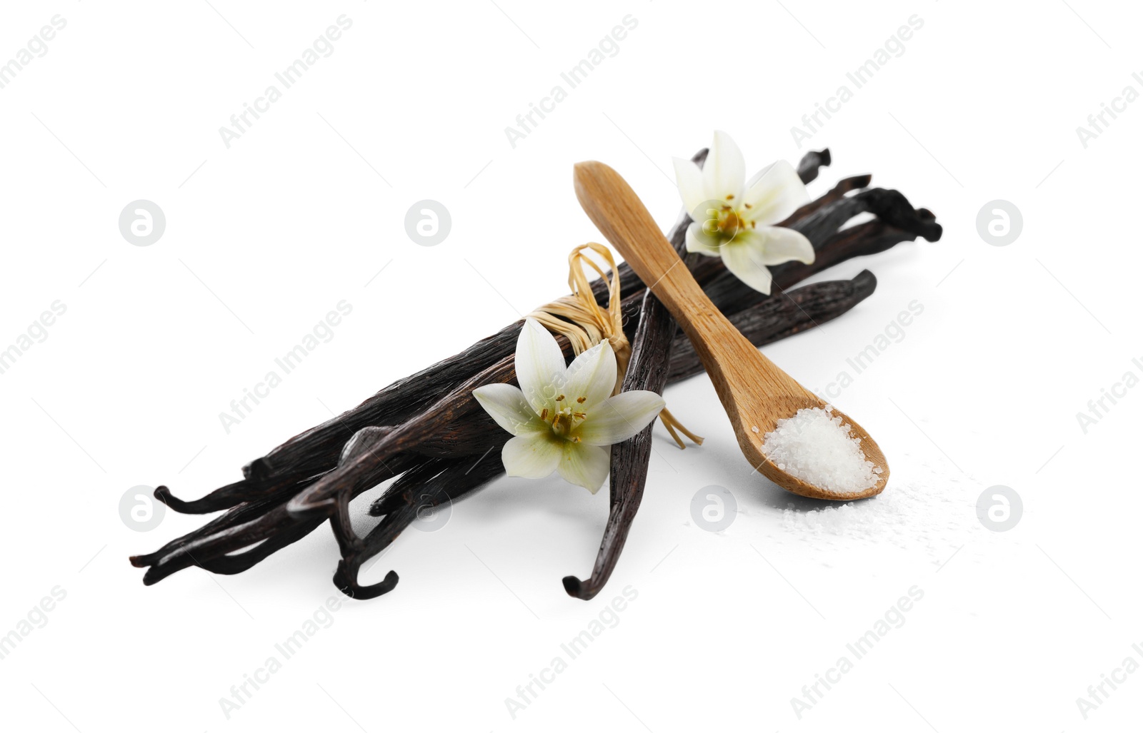 Photo of Vanilla pods, spoon with sugar and flowers isolated on white