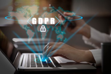 Image of General Data Protection Regulation. Woman pressing button on laptop at table, closeup. World map, GDPR abbreviation and padlock over device