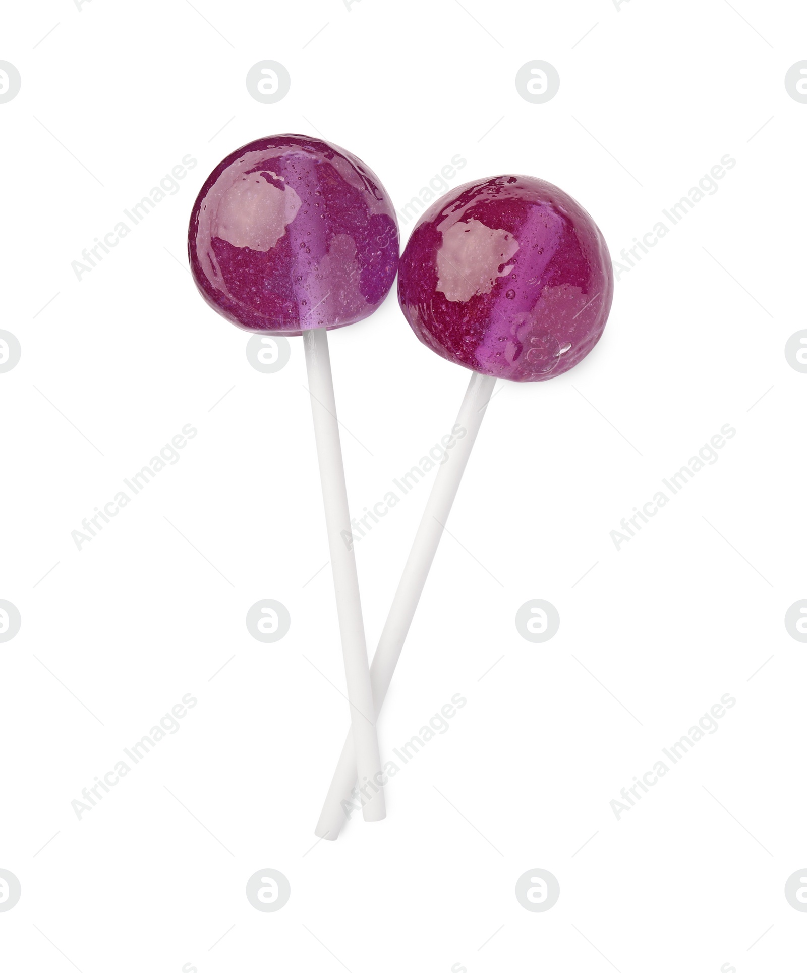 Photo of Two sweet purple lollipops isolated on white, top view