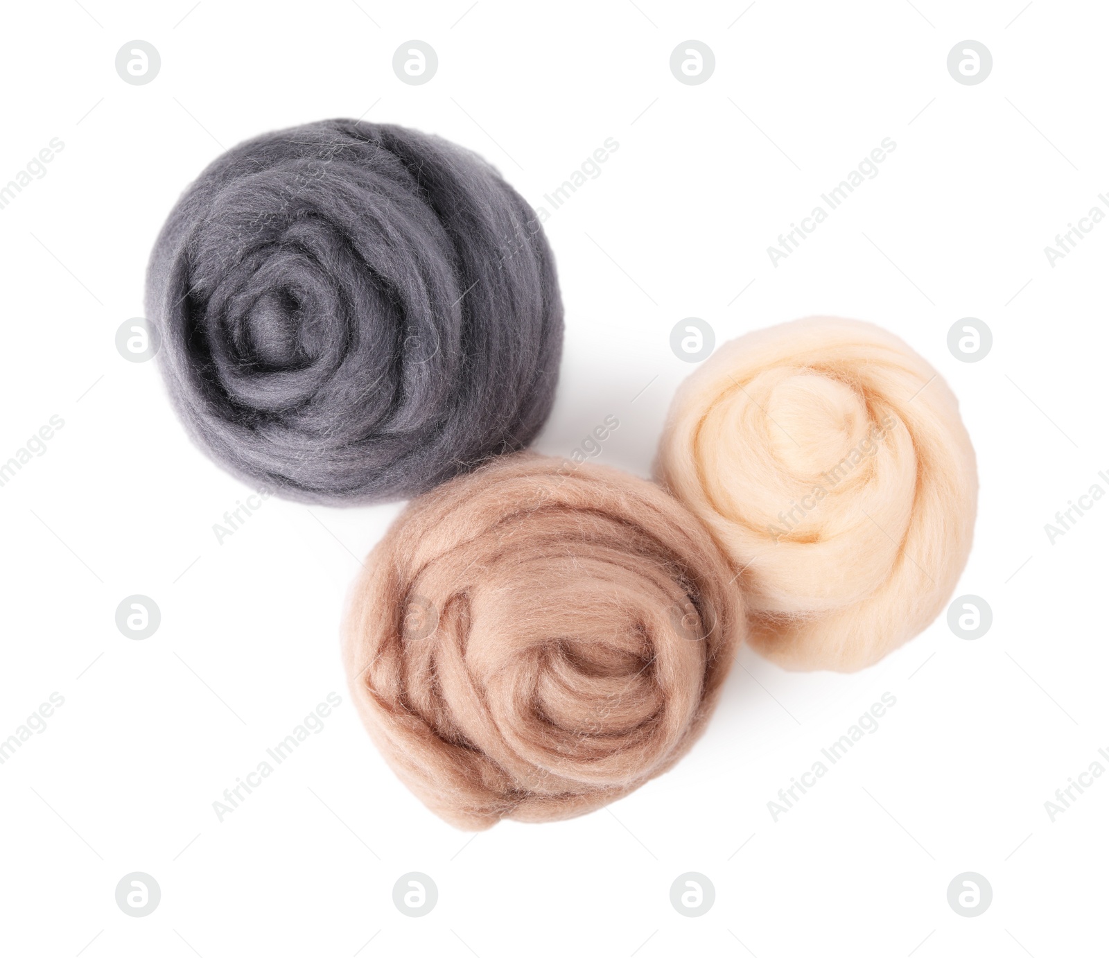 Photo of Beige and grey felting wool isolated on white, top view