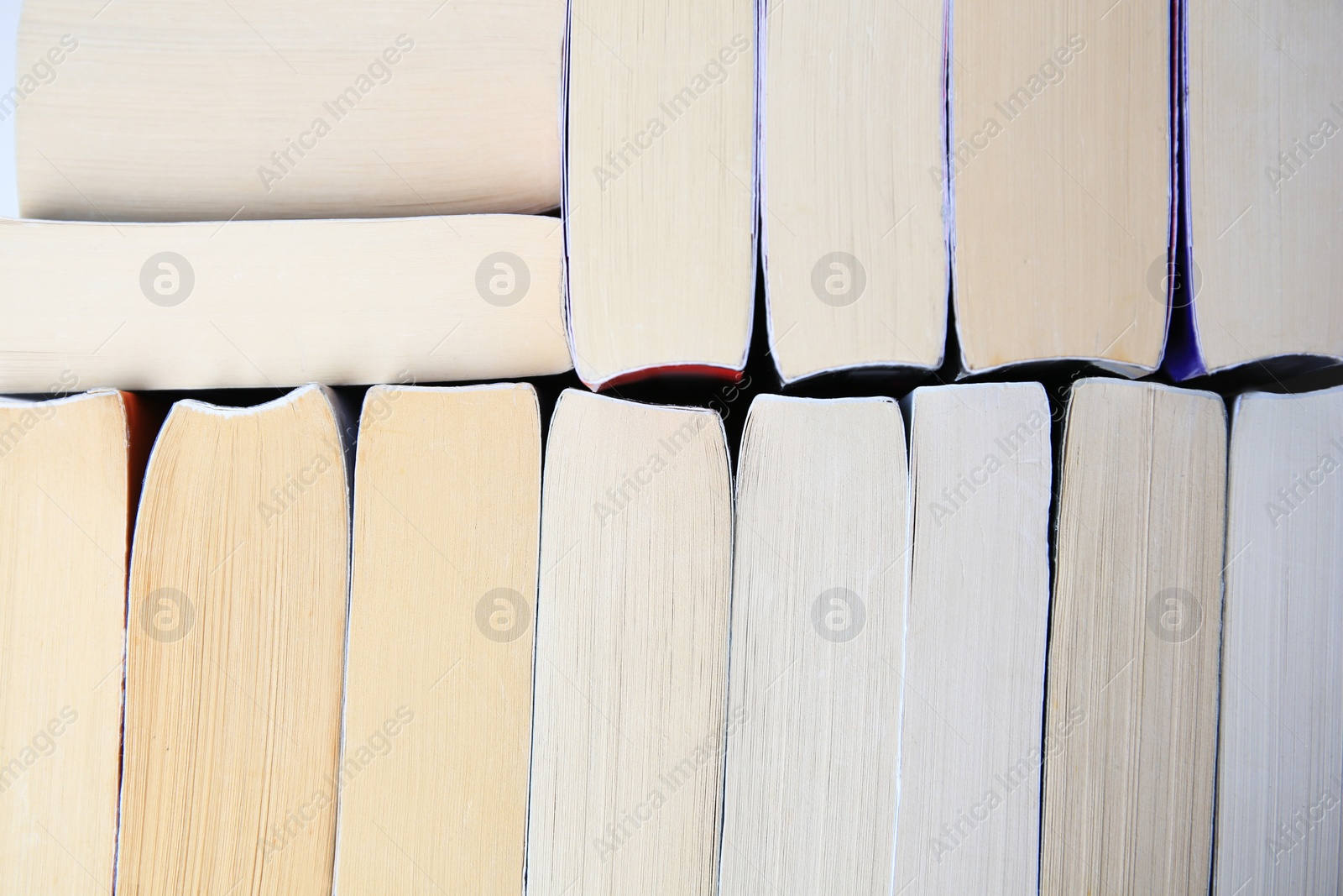 Photo of Collection of different books as background, closeup