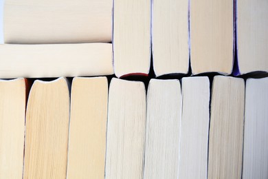 Photo of Collection of different books as background, closeup