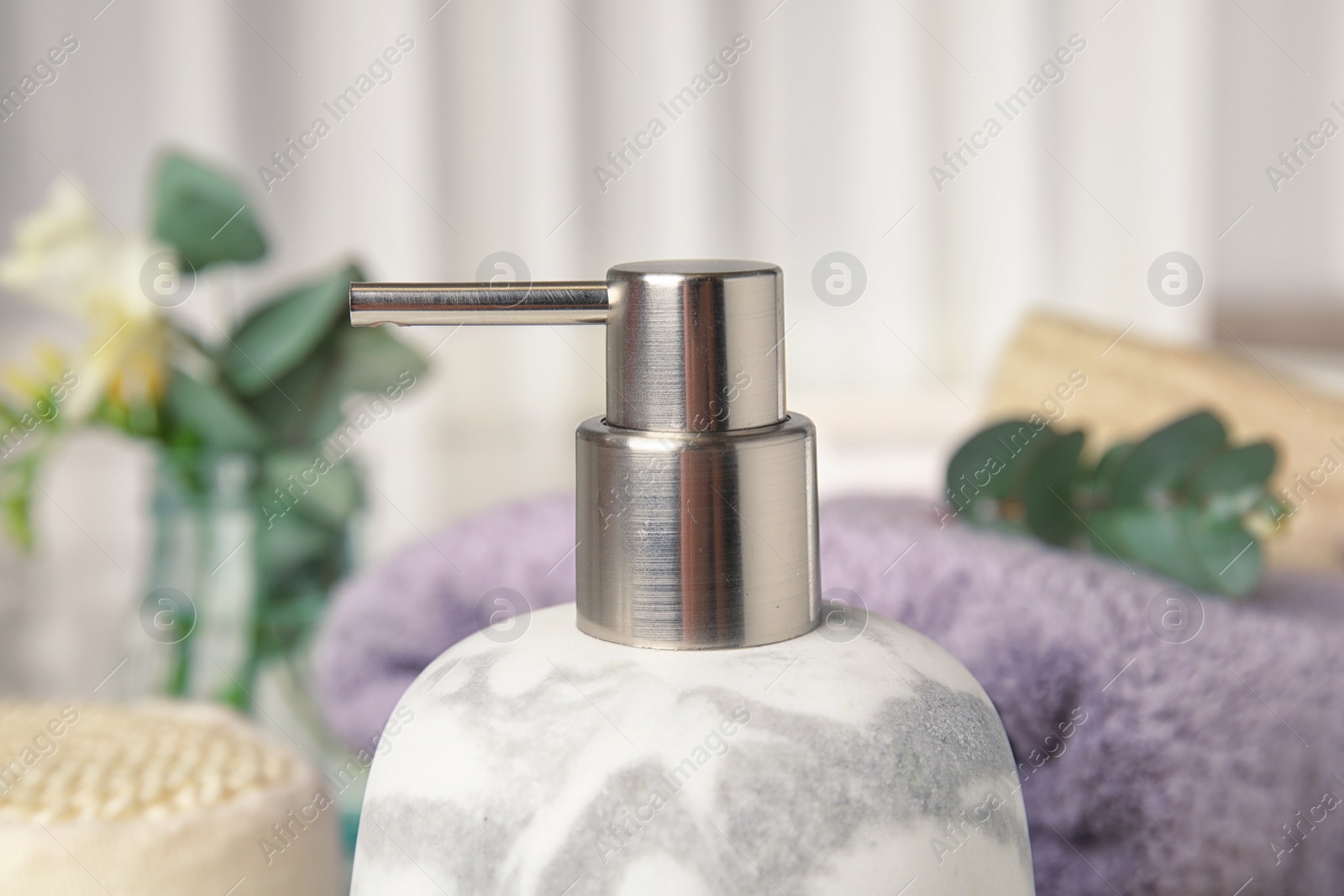 Photo of Modern marble soap dispenser in bathroom, closeup