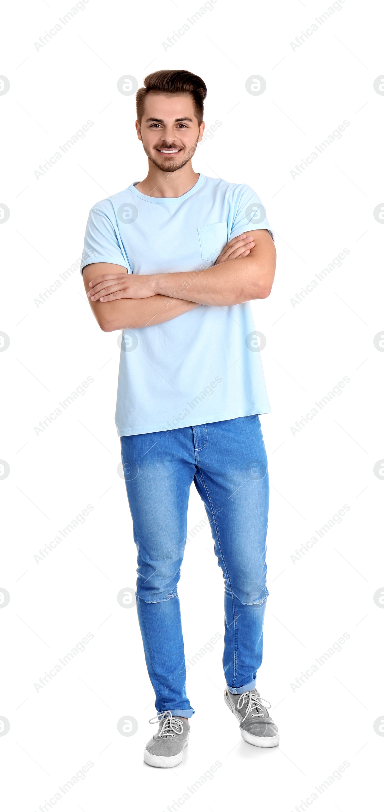 Photo of Young man in stylish jeans on white background