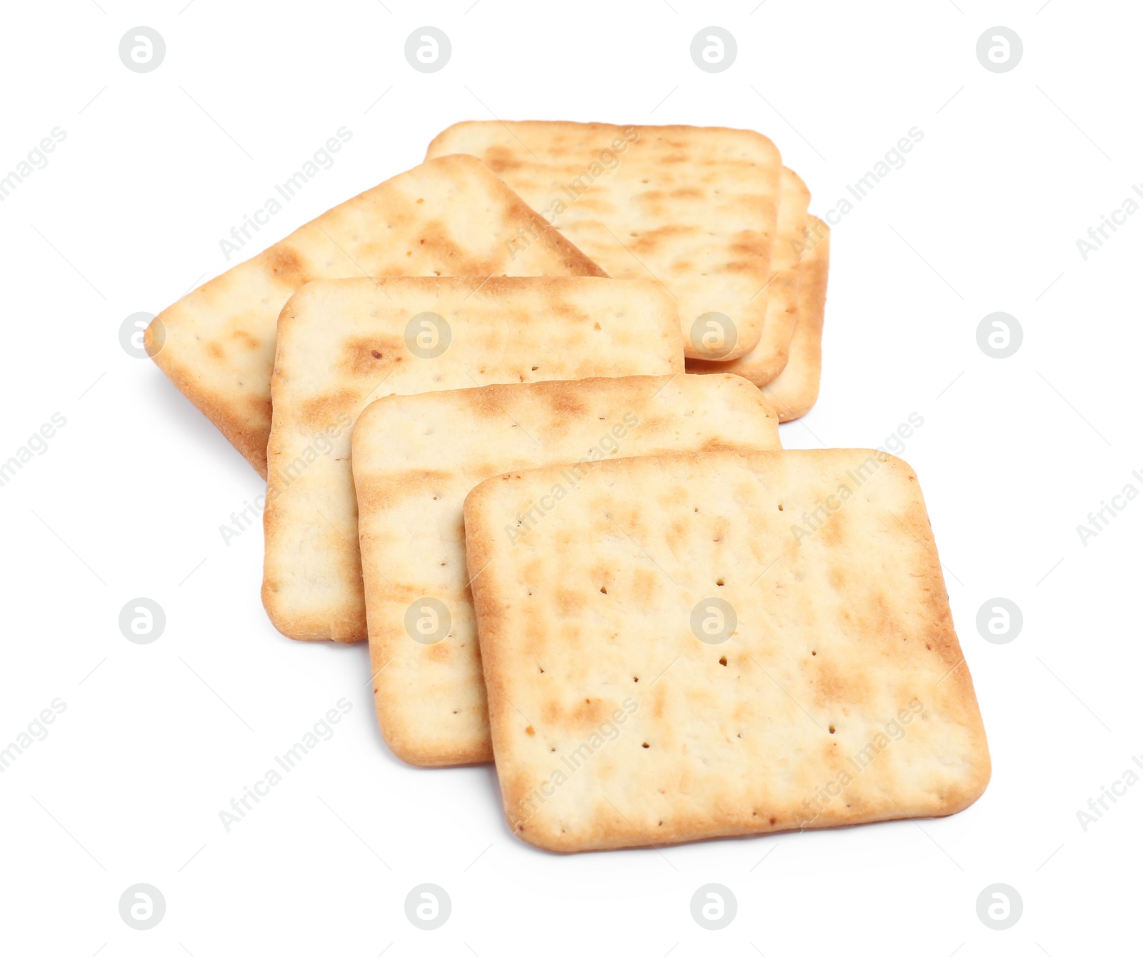 Photo of Tasty crispy square crackers isolated on white