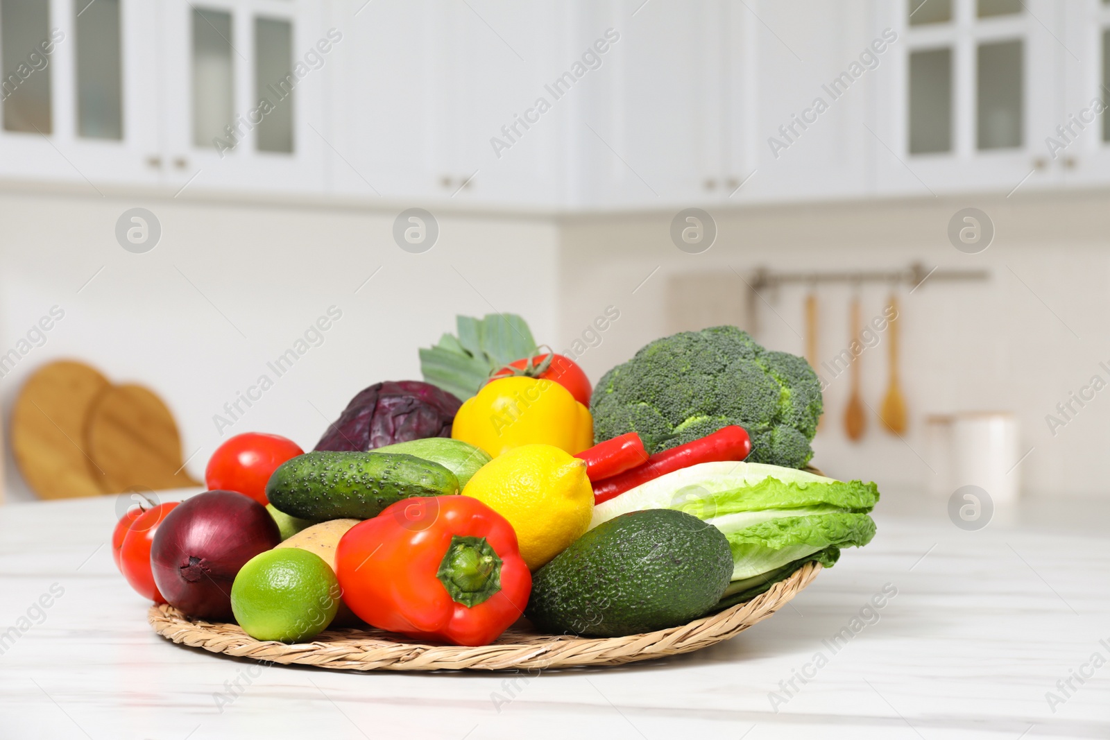 Photo of Pile of fresh ripe vegetables and fruits on table in kitchen