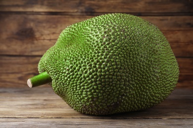 Fresh raw exotic jackfruit on wooden table