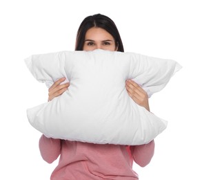 Young woman covering face with pillow on white background