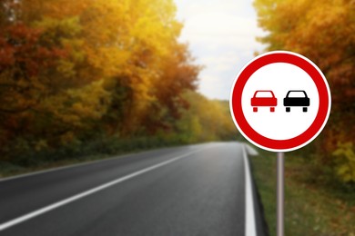 Image of No Overtaking road sign on highway, space for text