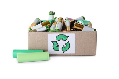 Image of Used electric batteries in cardboard box with recycling symbol on white background