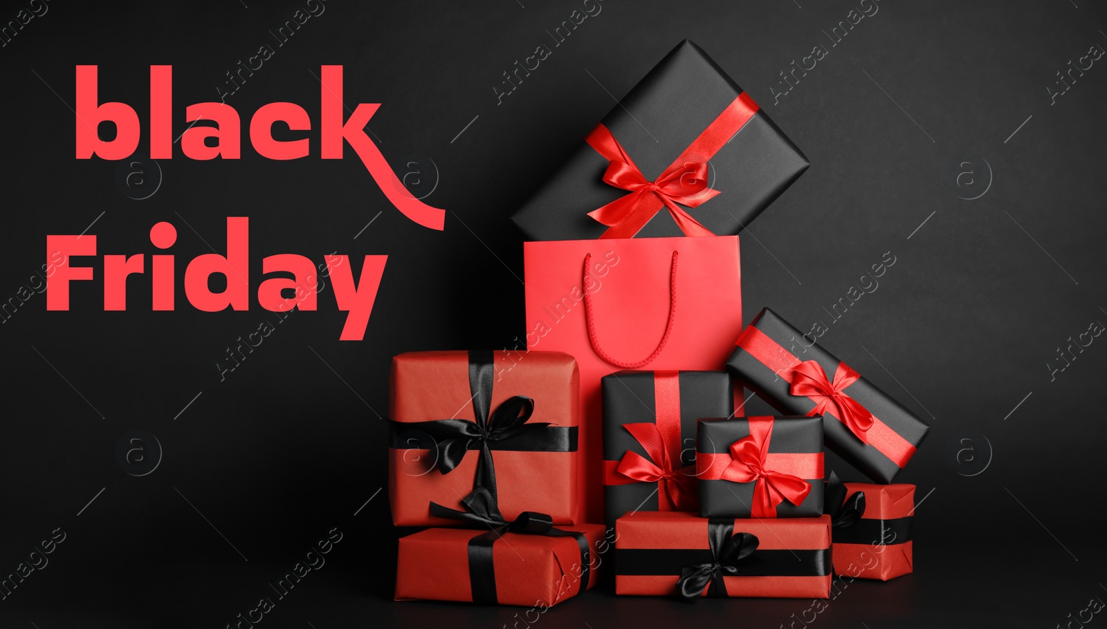 Photo of Many gifts and words Black Friday on dark background