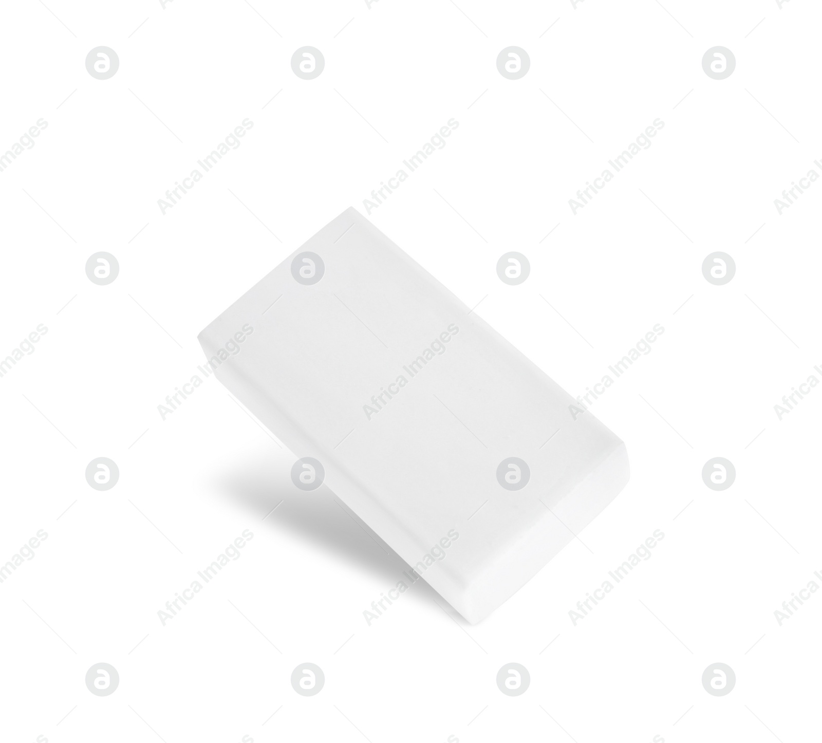 Photo of New eraser isolated on white. School stationery